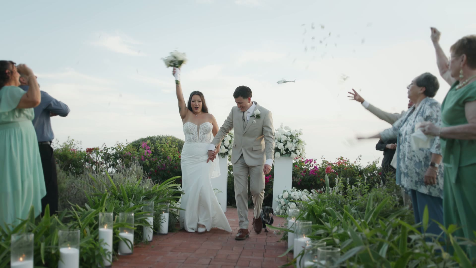 Newlyweds celebrating with their guests after the ceremony